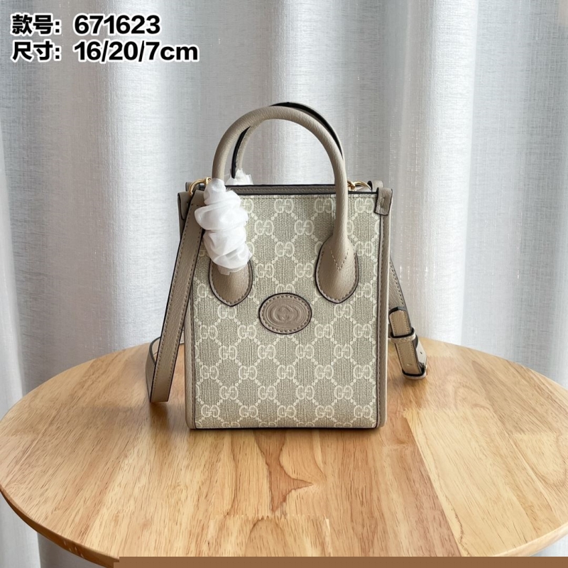 G*u*i top handle bags